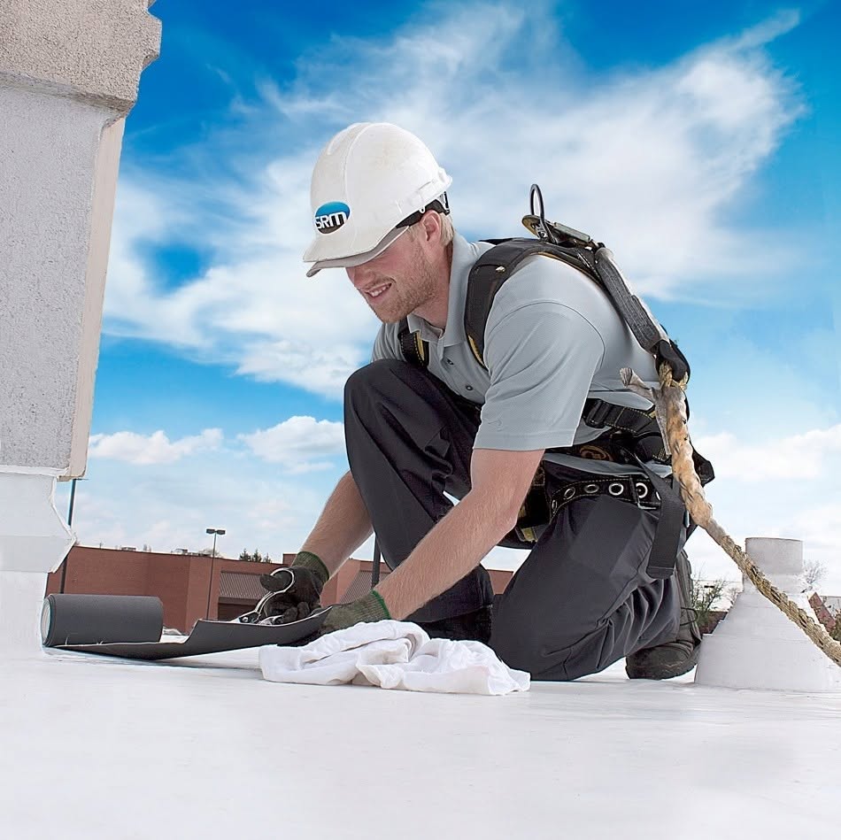 SRM technician maintaining a commercial roof